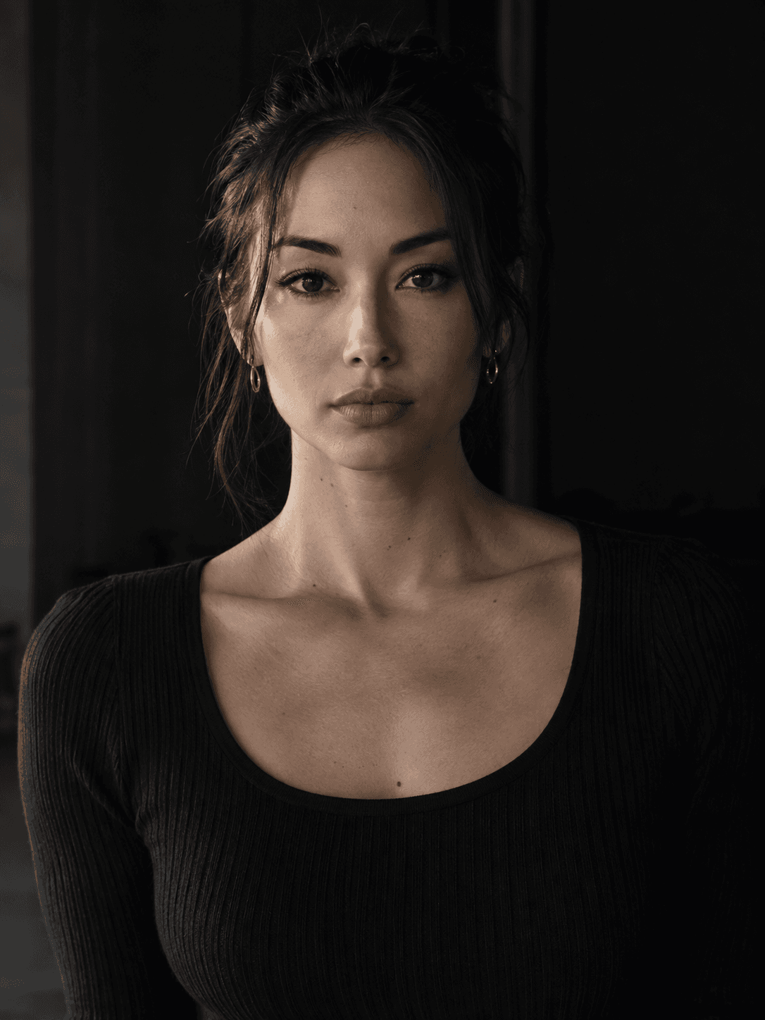 Yuki Tanaka-Brooks, waist-up portrait on the floor they coach